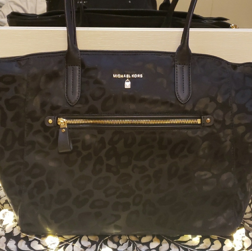 Black and leopard print Michael Kors bag.